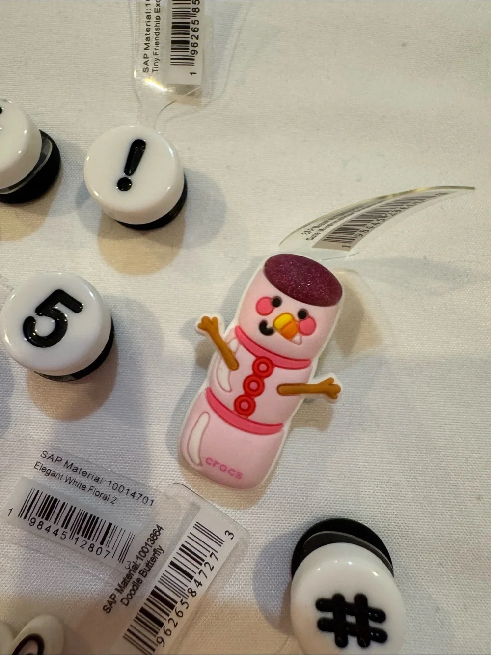 CROCS Pink Snowman Jibbitz Charm with Red Buttons and Purple Hat